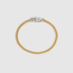 A gold-toned curb chain bracelet with a silver-toned lobster clasp, displayed on a light gray background.