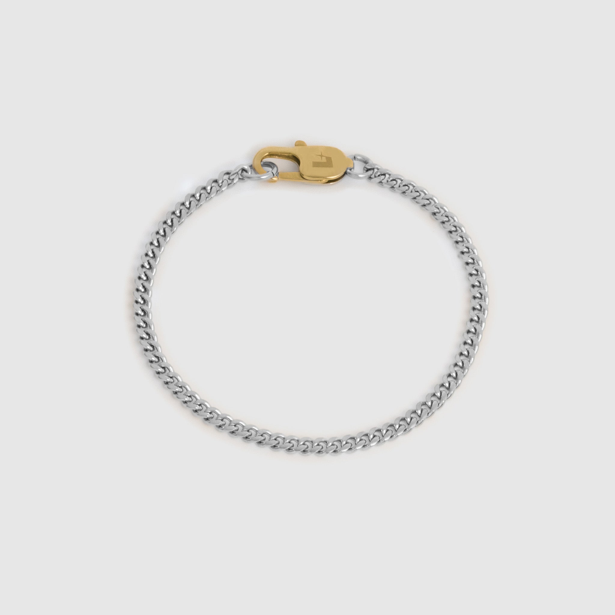 A silver-toned chain bracelet with a gold-toned lobster clasp, displayed on a light gray background.