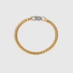 A gold-tone Cuban link chain bracelet with a silver-tone lobster clasp, displayed on a light gray background.