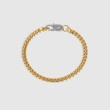A gold-tone Cuban link chain bracelet with a silver-tone lobster clasp, displayed on a light gray background.