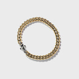 Gold thick chain bracelet with silver clasp on white background