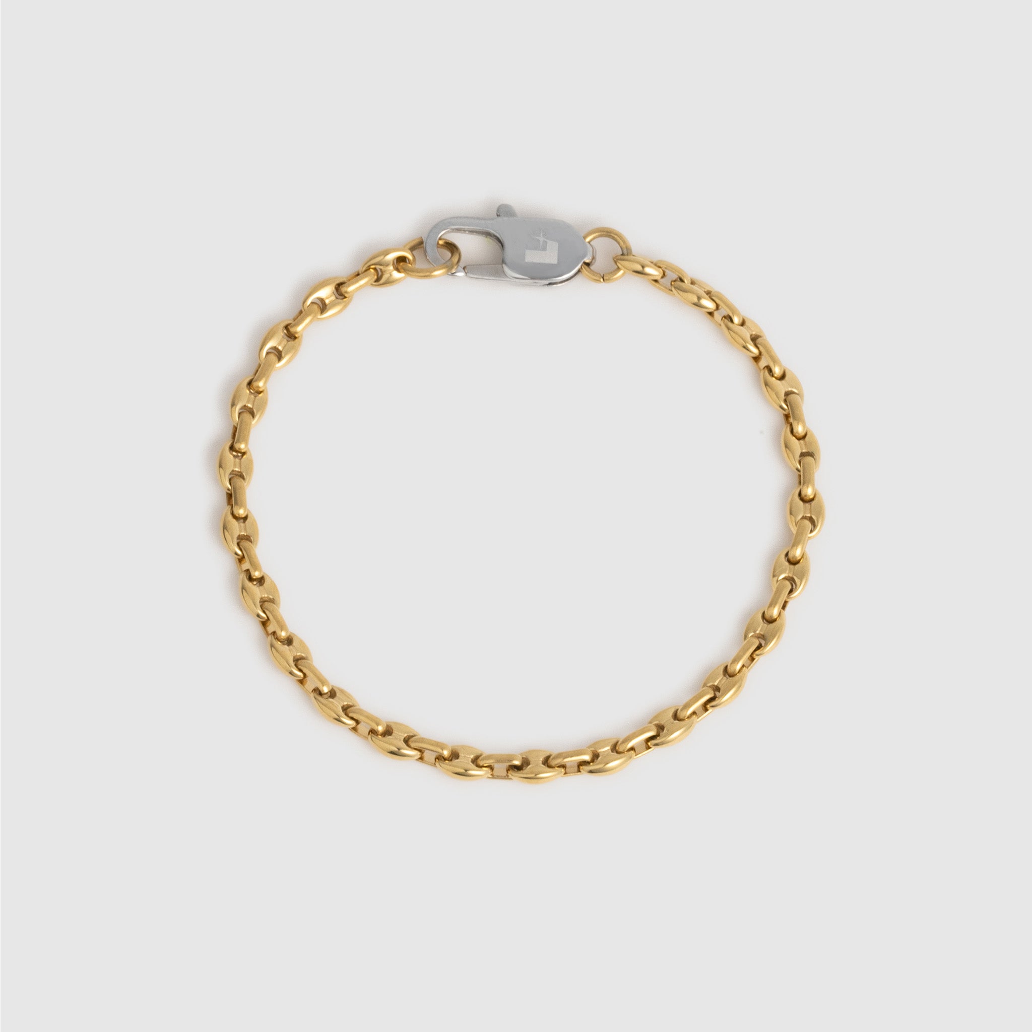 A gold chain bracelet with a silver-toned lobster clasp, displayed on a light gray background.