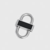 A silver-toned metal lock with a black rectangular inlay on the front, shown on a plain light gray background.