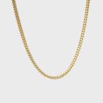 Gold cuban chain on white background