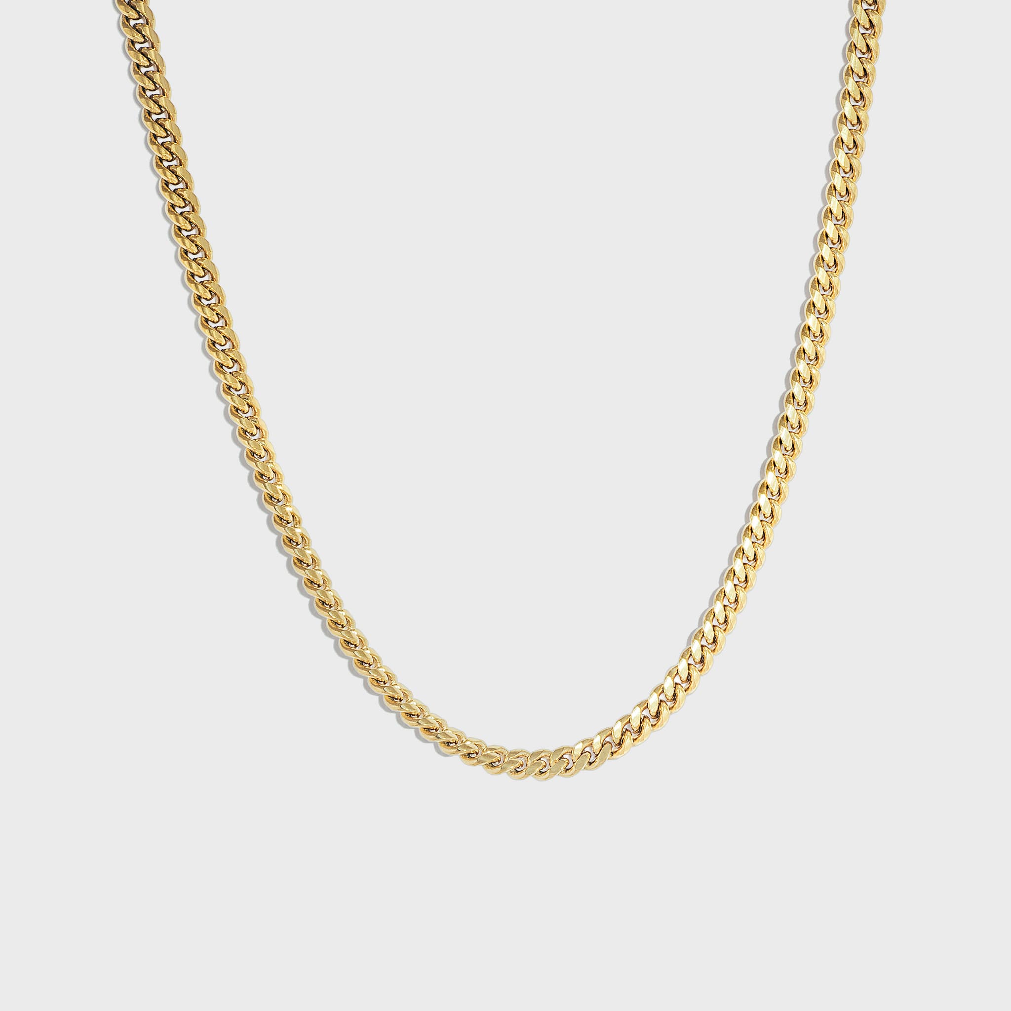 Gold cuban chain on white background