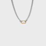 Silver cuban chain with gold carabiner clasp on white background