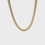 Thick gold Cuban chain on white background