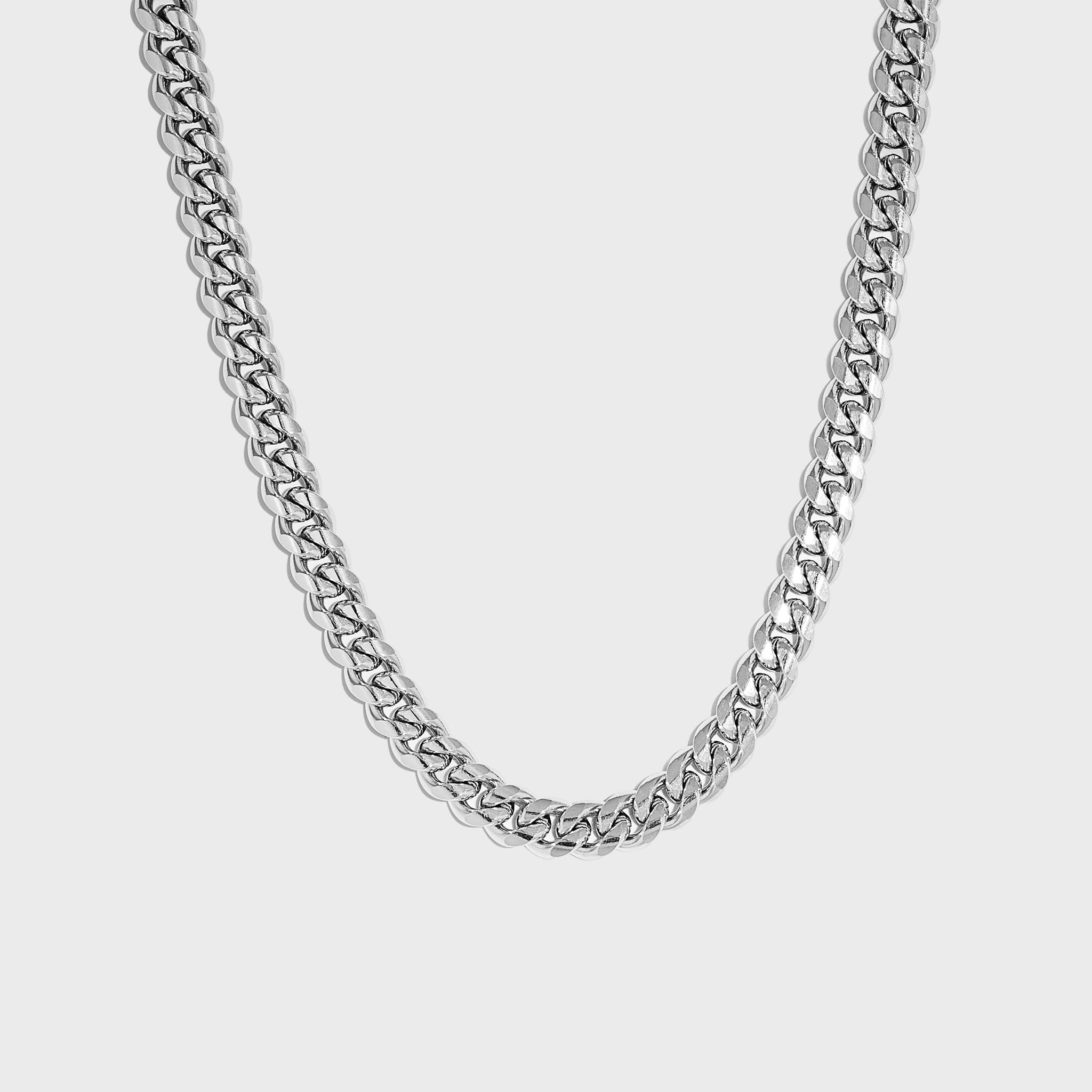 Thick silver cuban chain on white background