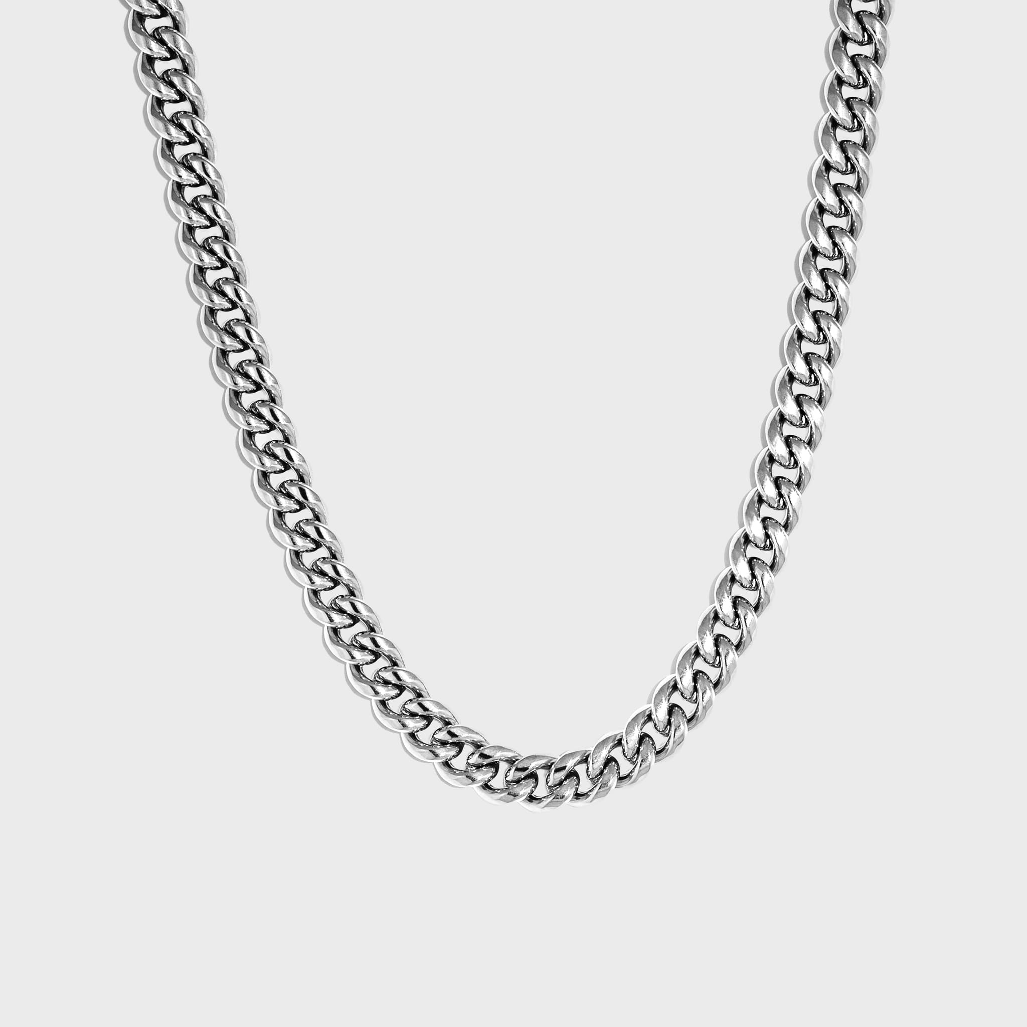Thick silver cuban chain on white background
