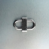 Silver double lock pendant featuring centered black diamond detail on gray background