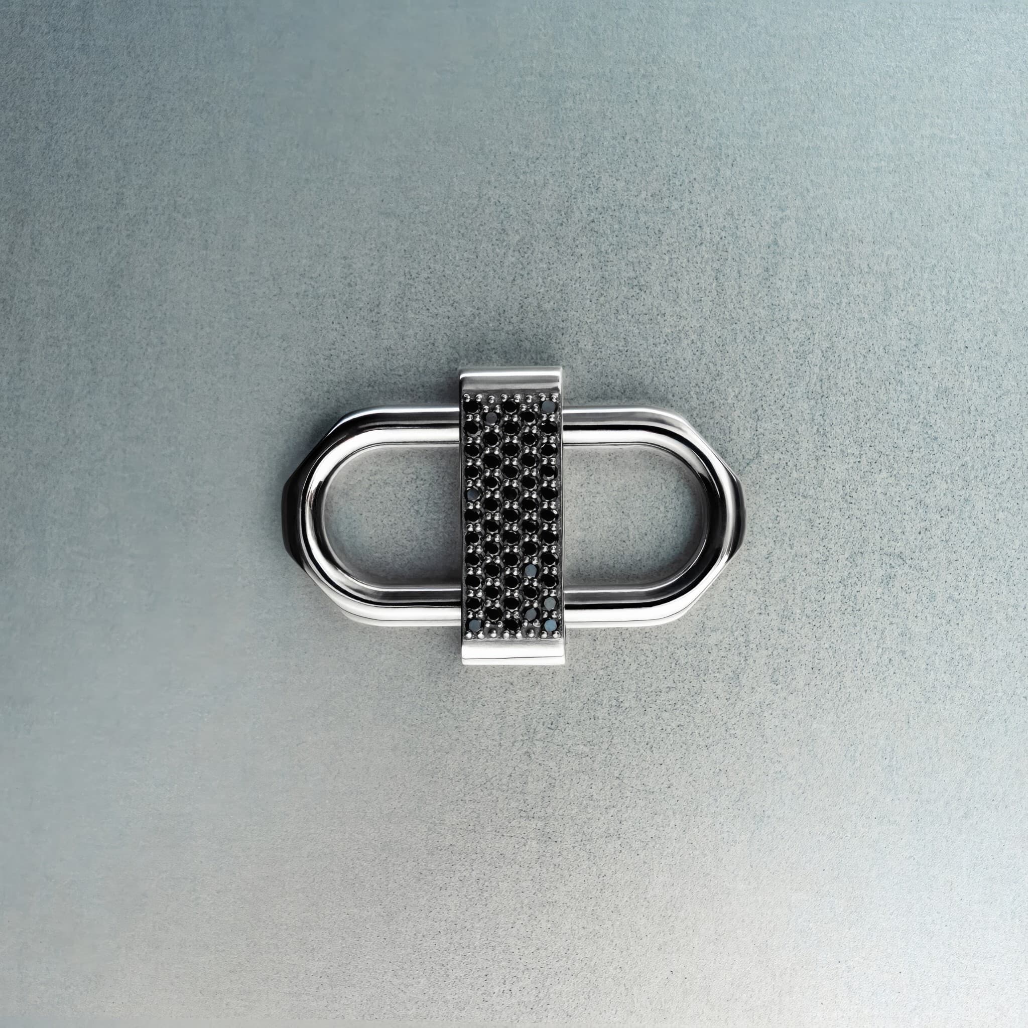 Silver double lock pendant featuring centered black diamond detail on gray background