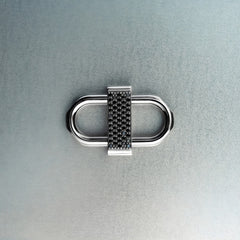 Silver double lock pendant featuring centered black diamond detail on gray background