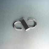Silver double open-lock pendant featuring centered black diamond detail on gray background