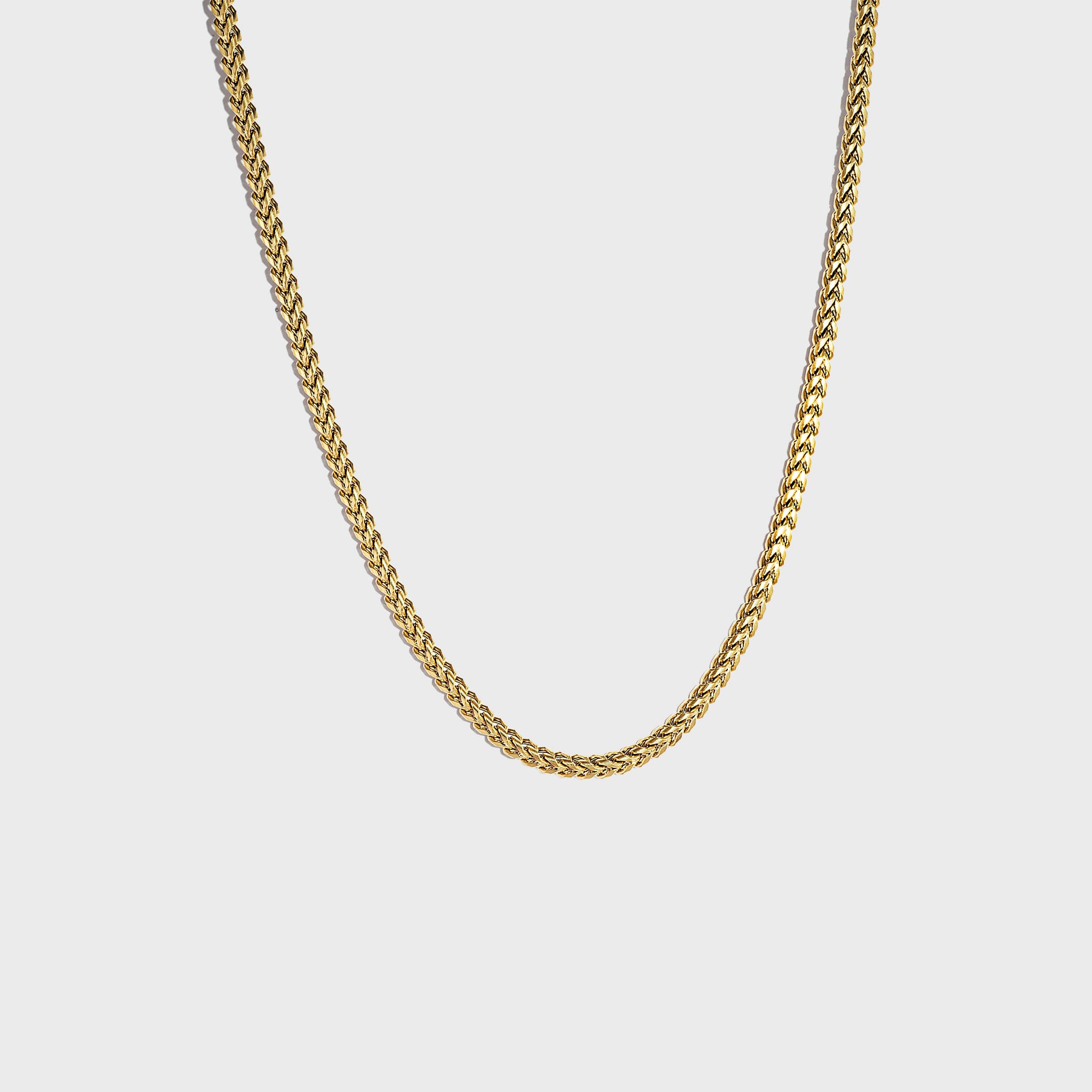 Gold chain on white background