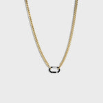 Gold chain with silver carabiner clasp on white background
