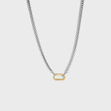 Silver chain with gold carabiner clasp on white background