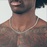 Close-up of man wearing silver chain necklace 