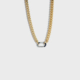 Thick gold chain with silver carabiner clasp on white background
