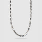 A silver-toned metal chain necklace with a washer link design, shown hanging against a light gray background.