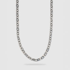 A silver-toned metal chain necklace with a washer link design, shown hanging against a light gray background.