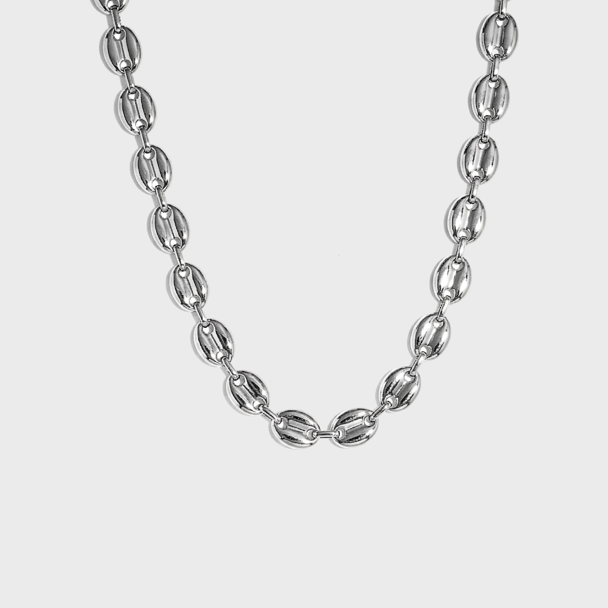 Silver mariner-link chain on white background