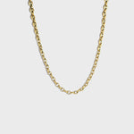 Gold mariner link chain on white background