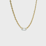 Gold mariner link chain with silver carabiner clasp on white background