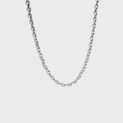 Silver mariner-link chain on white background