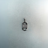 Rectangular six-sided silver tag pendant with centered diamond cluster, top and bottom cutout details
