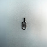 Rectangular six-sided silver tag pendant with centered diamond cluster, top and bottom cutout details, and jump ring