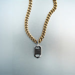 Gold chain necklace with rectangular six-sided silver lock pendant featuring centered diamond cluster and cutout detailing