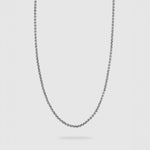 A silver-toned metal chain necklace with a classic box link design, shown hanging in a U-shape against a solid light gray background.