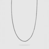 A silver-toned metal chain necklace with a classic box link design, shown hanging in a U-shape against a solid light gray background.