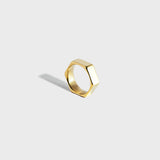 Gold hex-style ring on white background