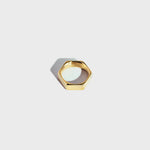 Gold hex-style ring on white background