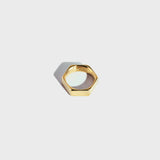 Gold hex-style ring on white background