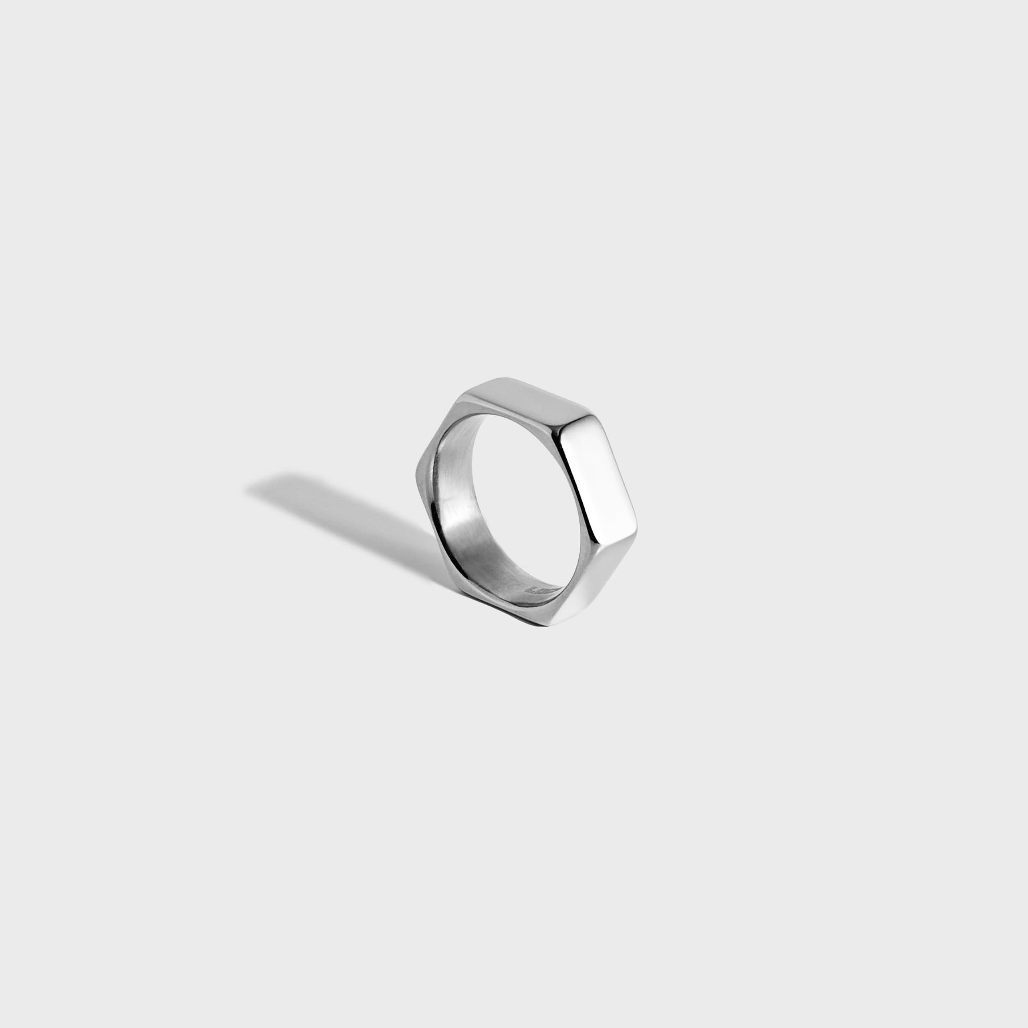 Silver hex-style ring on white background