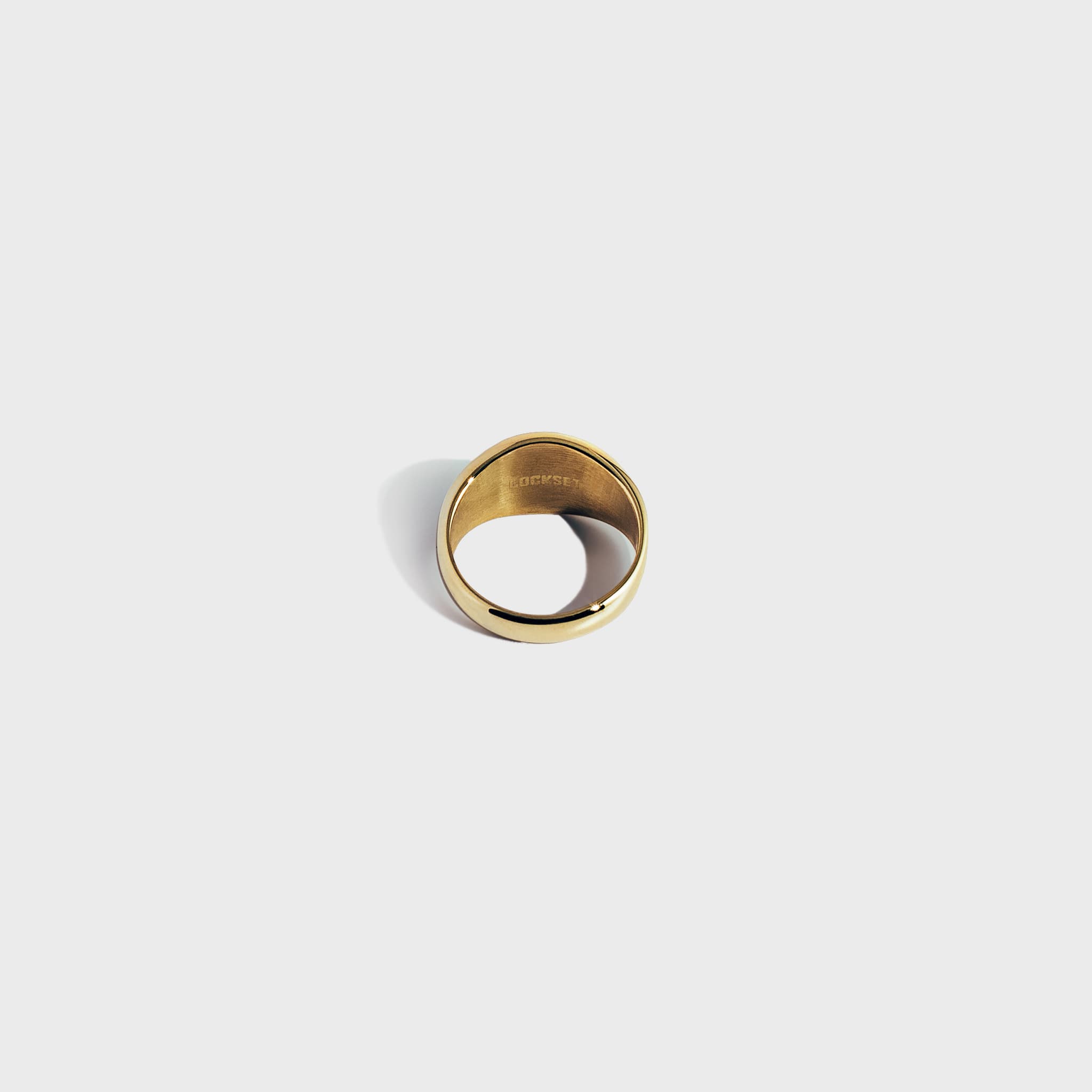 Gold ring on white background