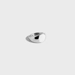 Round silver signet ring on white background