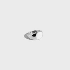 Round silver signet ring on white background